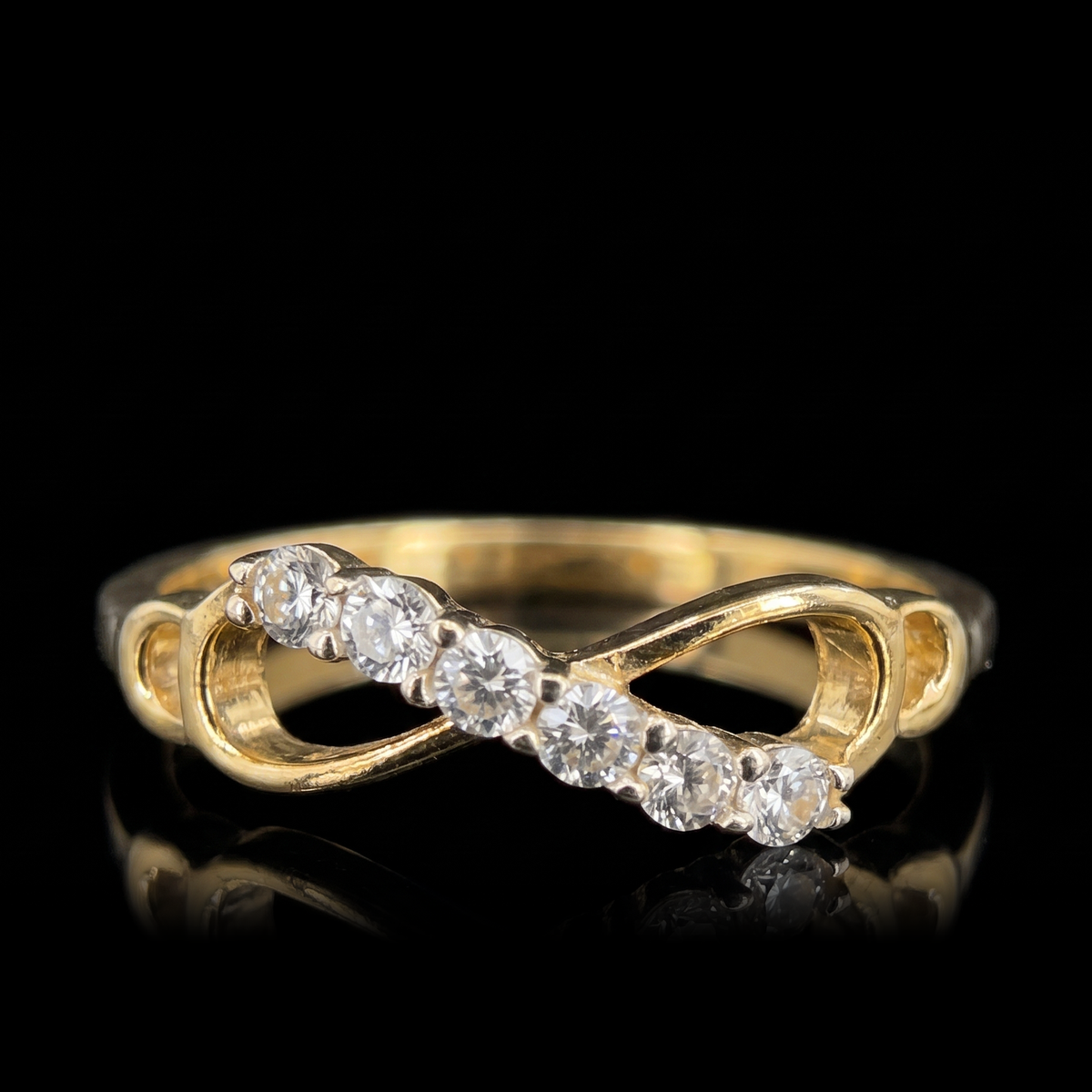 10k gold CZ infinity ring, infinity front view on black