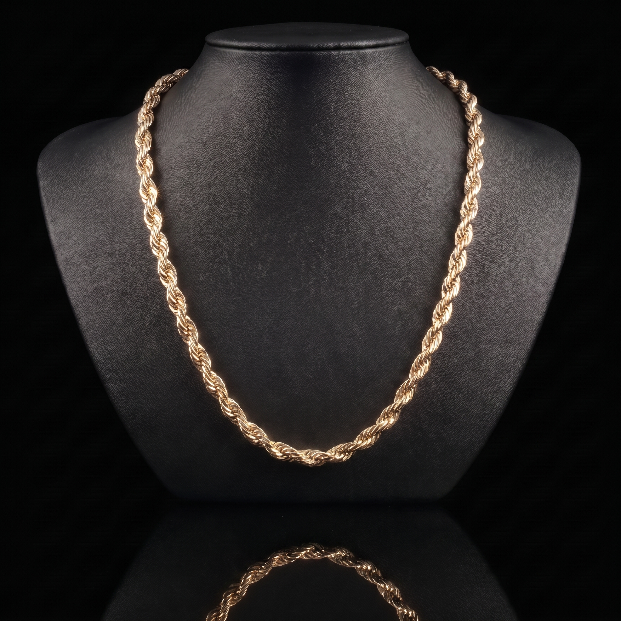 10k gold hollow diamond-cut rope chain draped on a black jewelry bust, front view