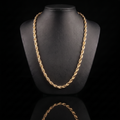 10k gold solid diamond-cut rope chain draped on a black jewelry bust, front view
