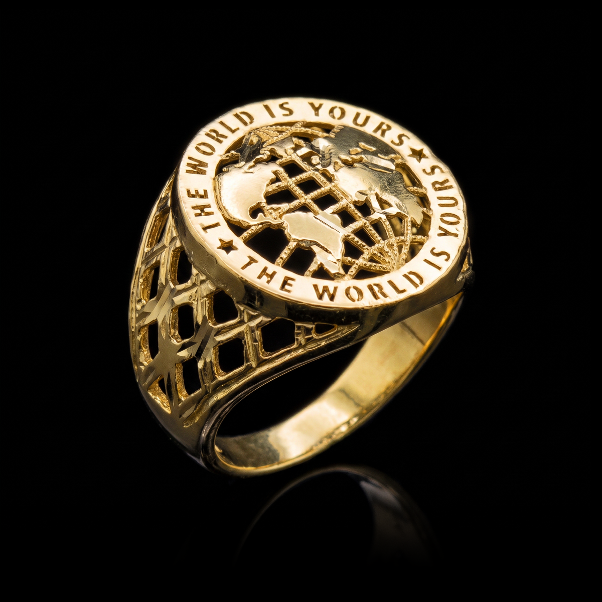 10k gold The World Is Yours ring 21mm at a 45-degree angle on black