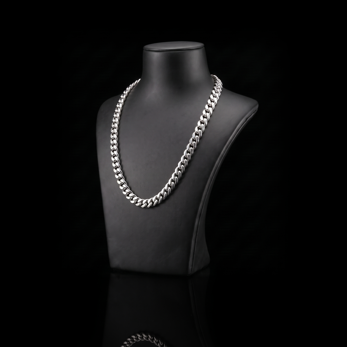 Silver 925 solid miami cuban chain 7mm on a black jewelry bust at a 45-degree angle