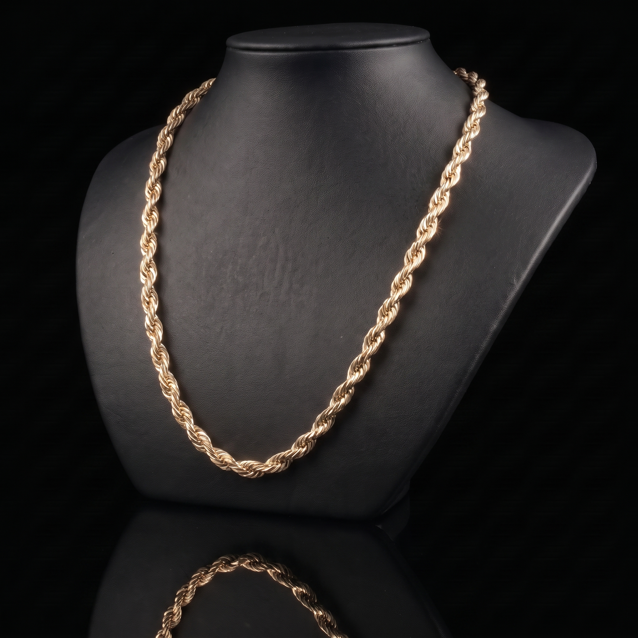 10k gold hollow diamond-cut rope chain on a black bust at a 45-degree angle