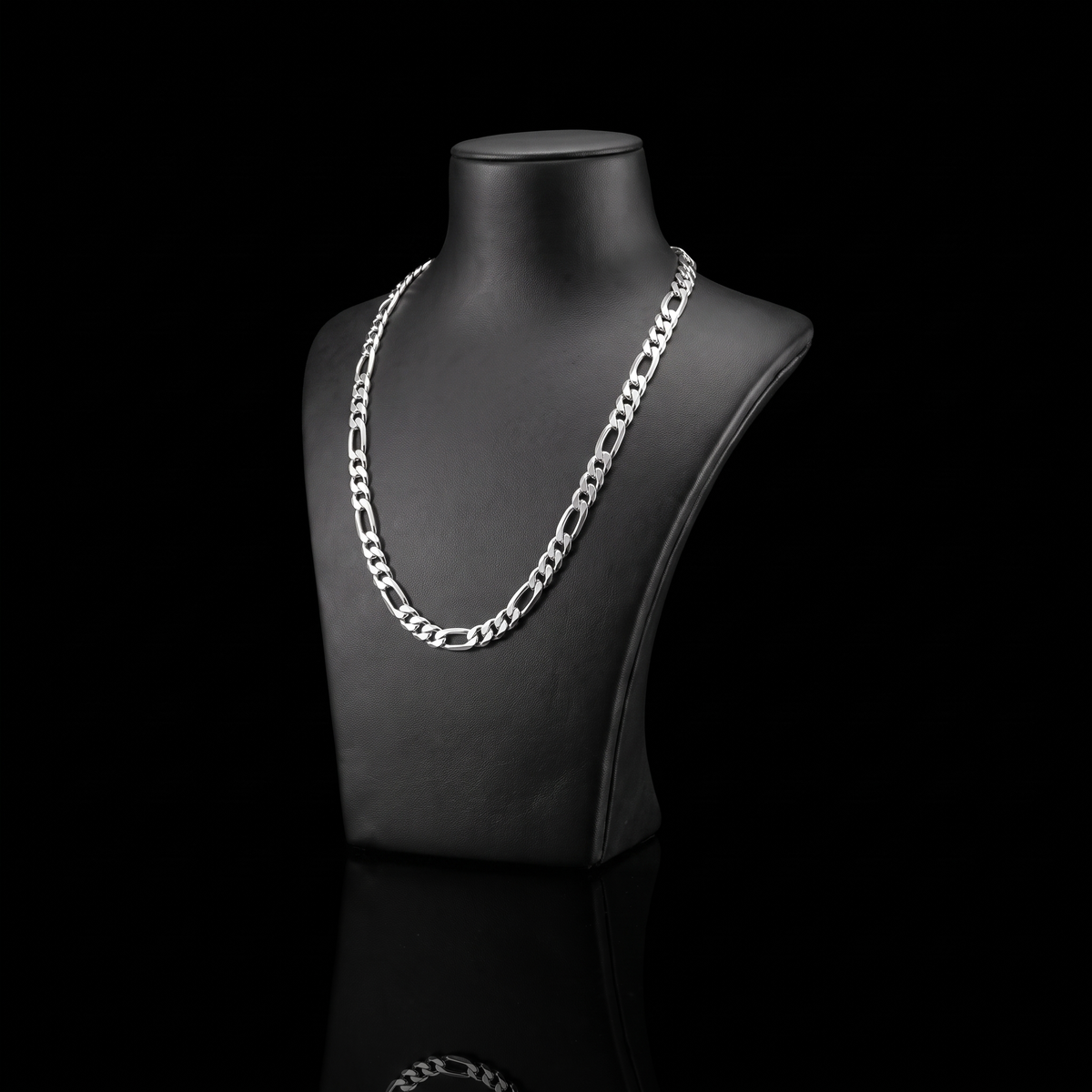 Silver 925 solid figaro chain 5.6mm on a black jewelry bust at a 45-degree angle