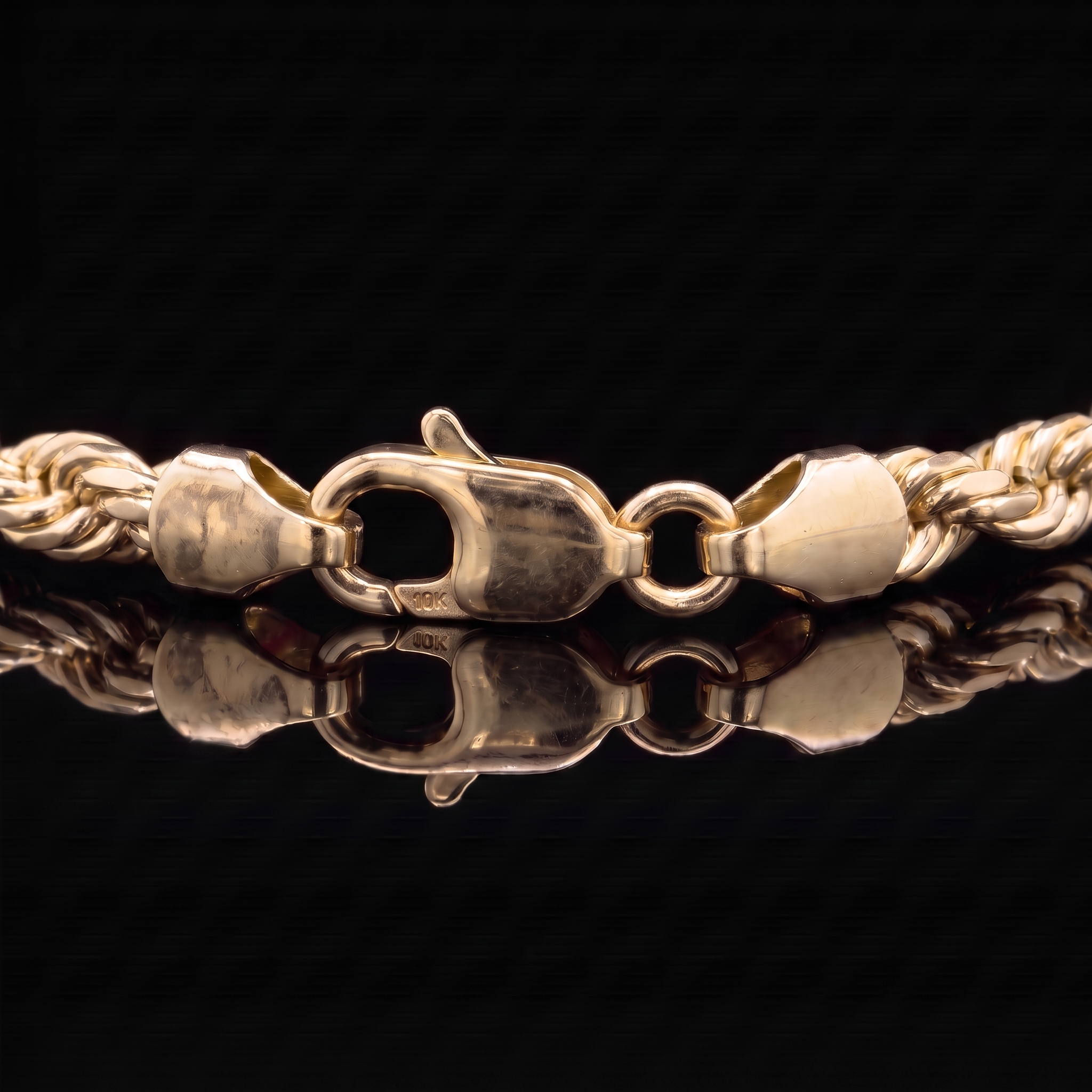 10k gold hollow rope chain lobster clasp macro on black