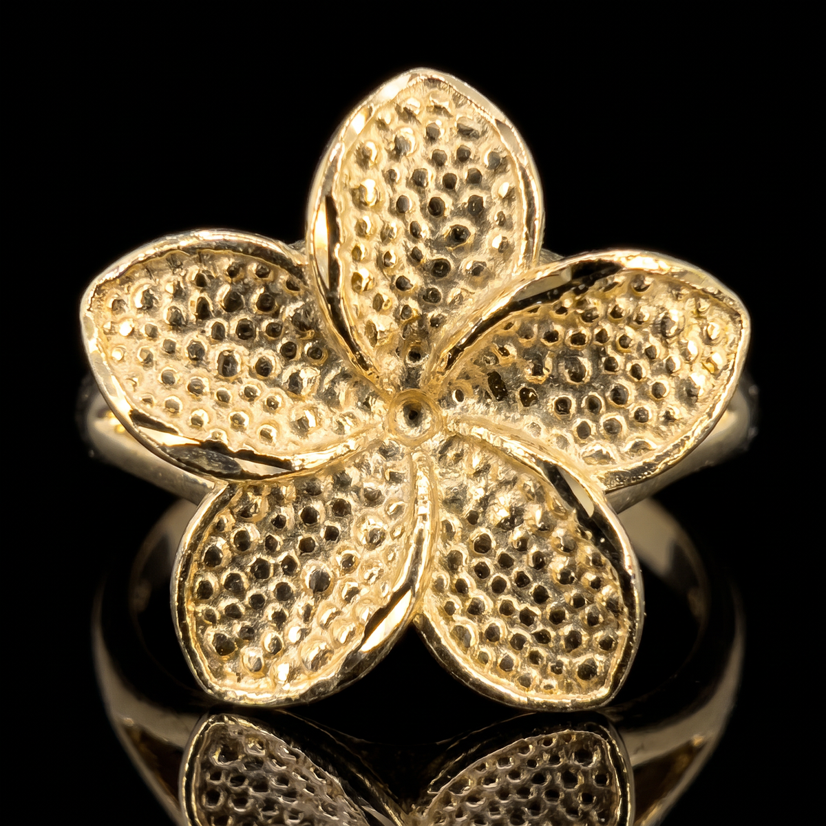 10k gold hibiscus flower ring flower detail macro on black
