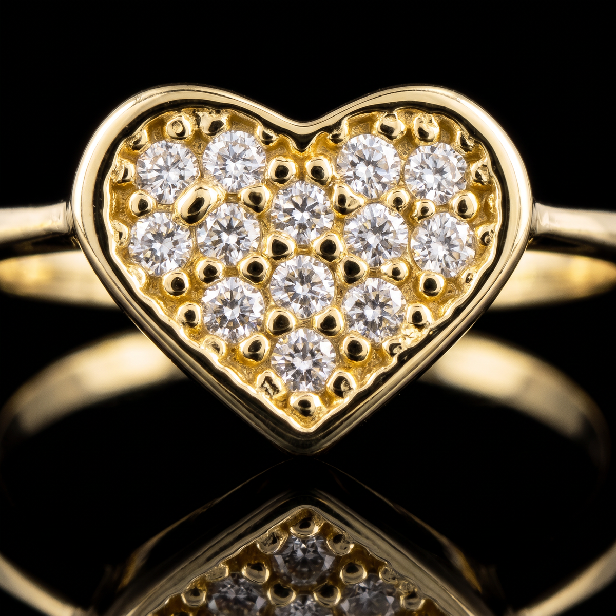 10k gold CZ pave heart ring pave heart detail macro on black