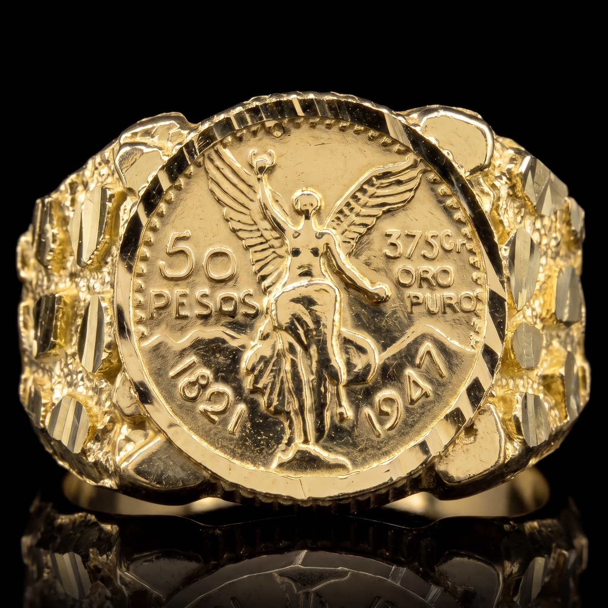 10k gold nugget circle Centenario ring 15mm Centenario coin face detail macro on black