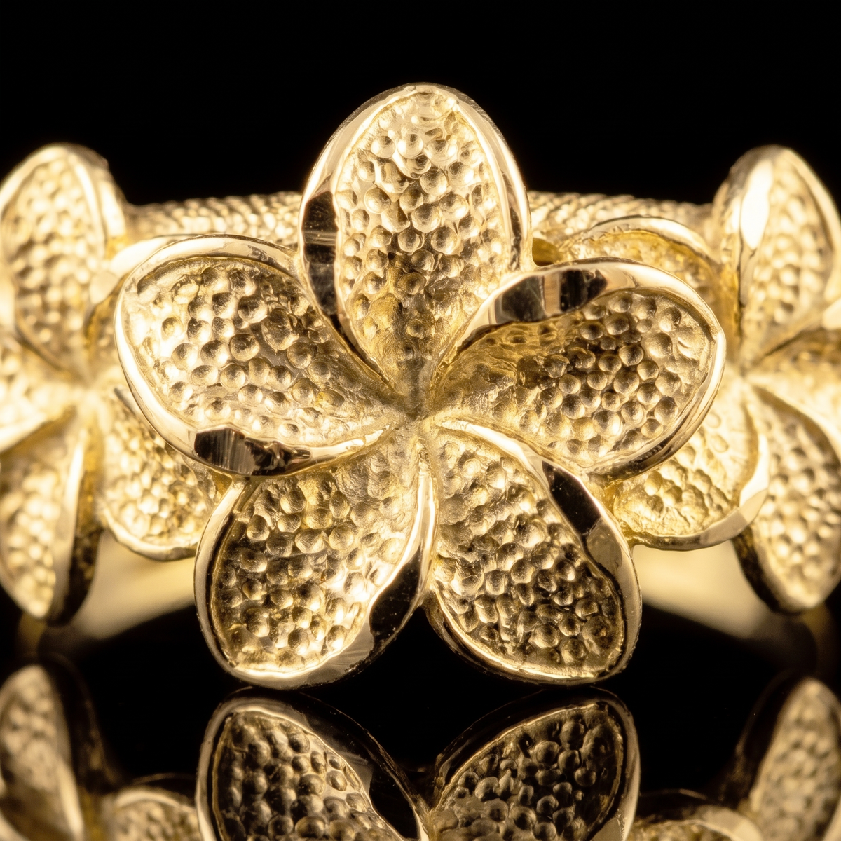 10k gold 3 hibiscus flower ring 9mm flower face detail macro on black