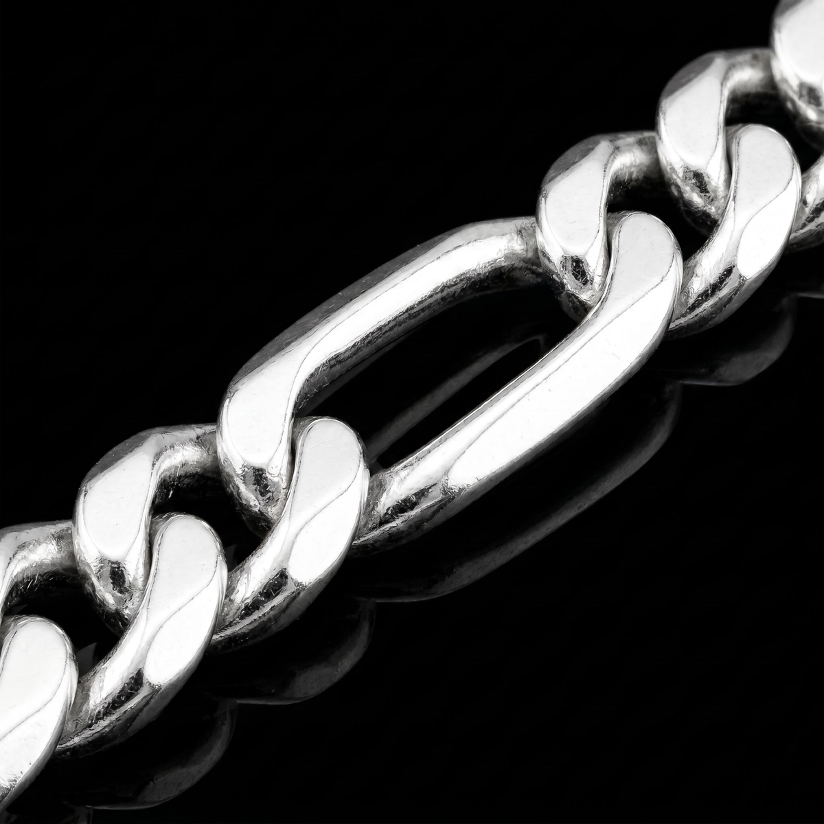Silver 925 solid figaro chain 5.6mm link detail macro on black