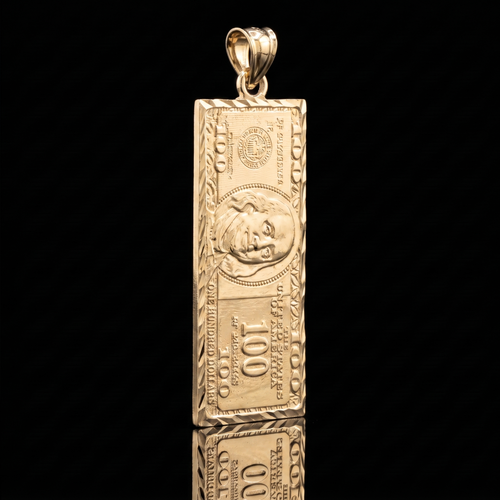 10k gold $100 bill pendant, angled on black