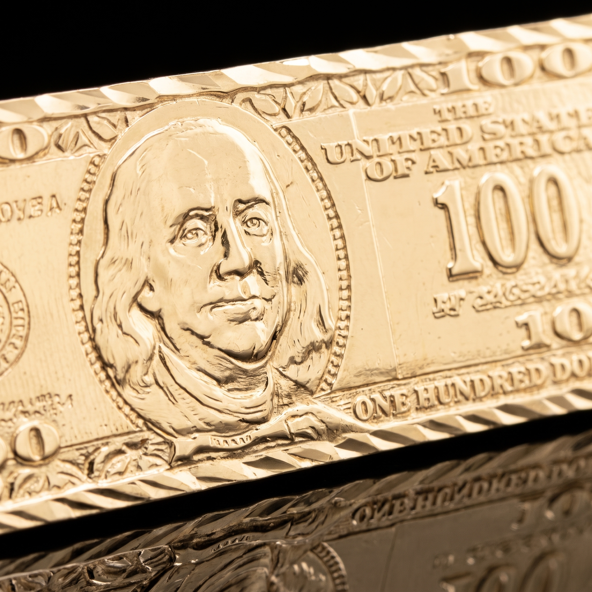 10k gold $100 bill pendant engraved detail macro on black