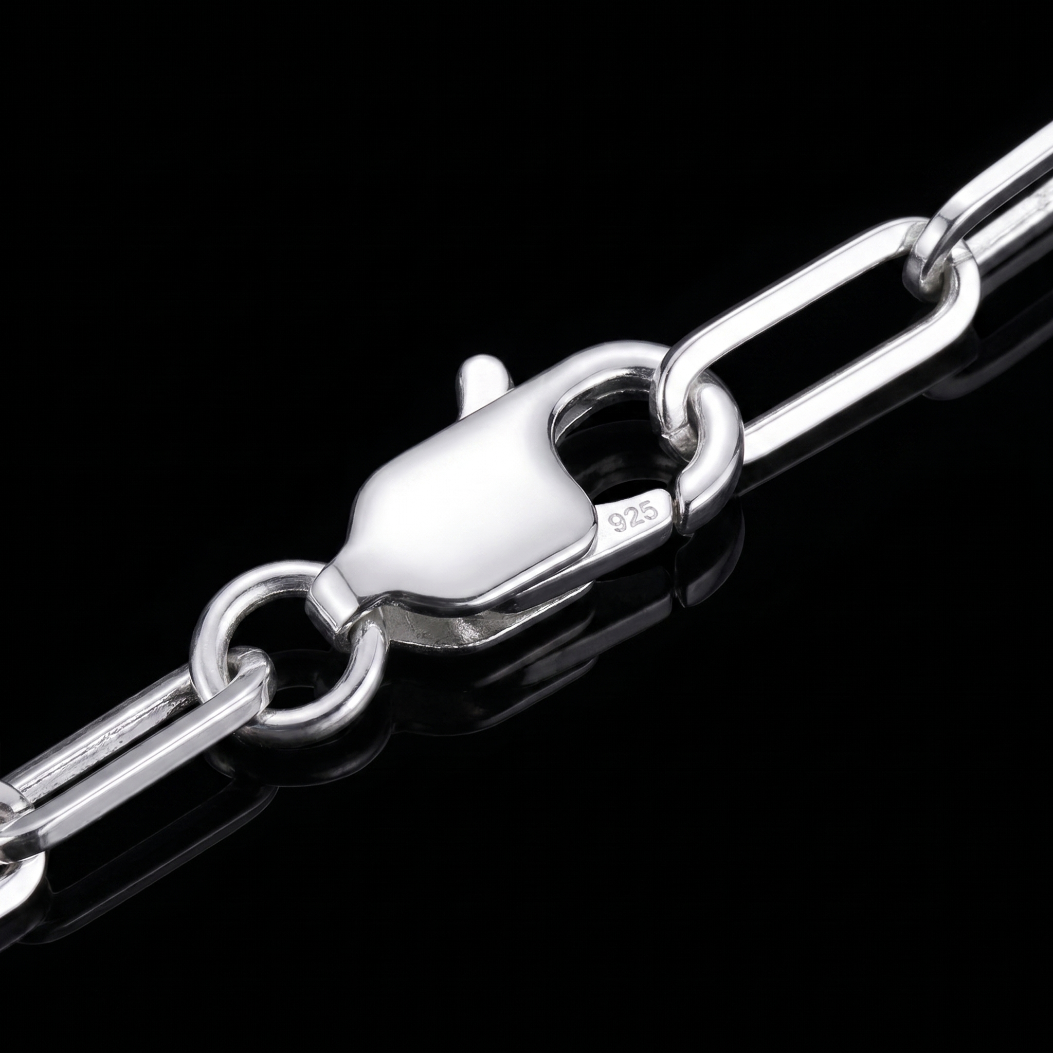 Silver 925 paperclip chain lobster clasp macro on black